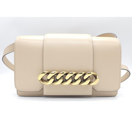 32 - A Givenchy Nude Infinity Crossbody Bag. Leather exterior with front flap, gold toned hardware, adjus... 