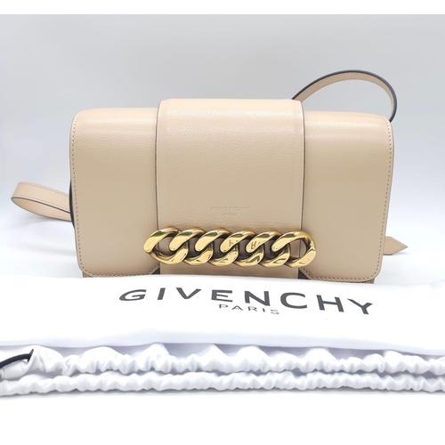 32 - A Givenchy Nude Infinity Crossbody Bag. Leather exterior with front flap, gold toned hardware, adjus... 