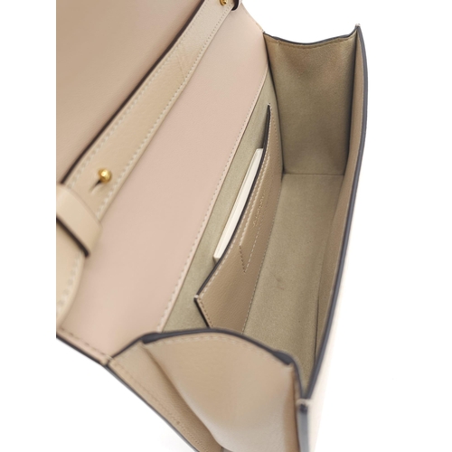 32 - A Givenchy Nude Infinity Crossbody Bag. Leather exterior with front flap, gold toned hardware, adjus... 