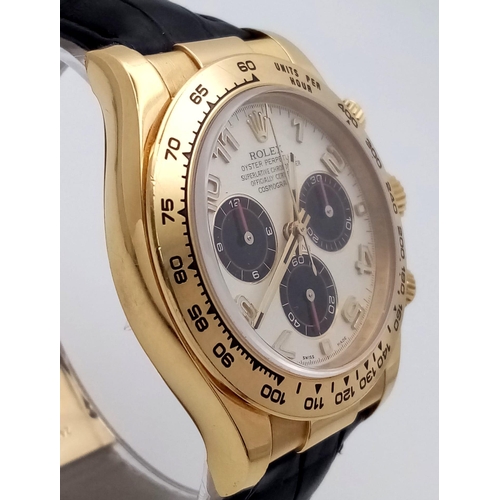 36 - A Rolex Daytona Chronograph Panda 18K Gold Gents Watch. Black leather strap with Rolex gold clasp. 1... 