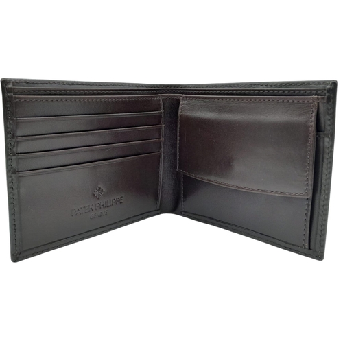 493 - Patek Philippe Brown Leather Men's Wallet.
Embossed motif on front, quality stitching throughout on ... 