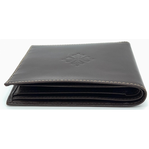 493 - Patek Philippe Brown Leather Men's Wallet.
Embossed motif on front, quality stitching throughout on ... 