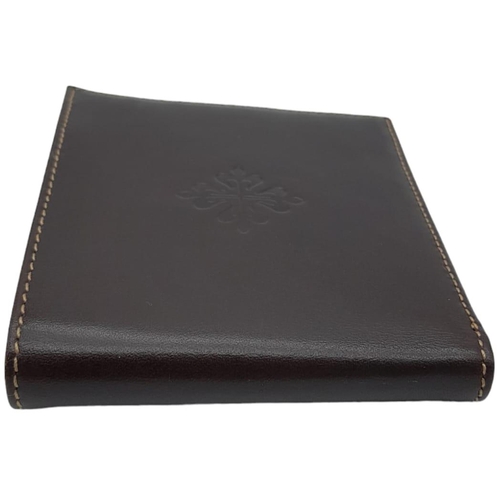 493 - Patek Philippe Brown Leather Men's Wallet.
Embossed motif on front, quality stitching throughout on ... 