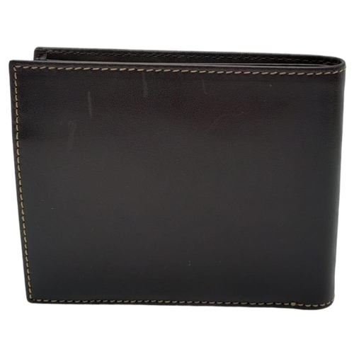 493 - Patek Philippe Brown Leather Men's Wallet.
Embossed motif on front, quality stitching throughout on ... 