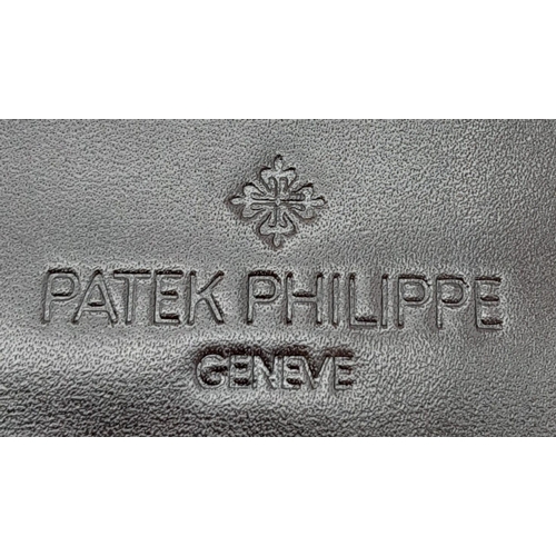 493 - Patek Philippe Brown Leather Men's Wallet.
Embossed motif on front, quality stitching throughout on ... 