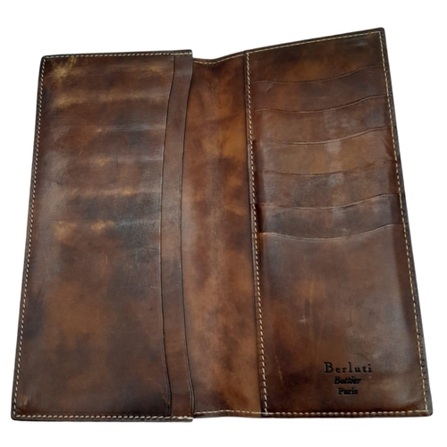 507 - Berluti Brown Leather Long Wallet.
Stitched throughout on quality leather, this unisex wallet opens ... 