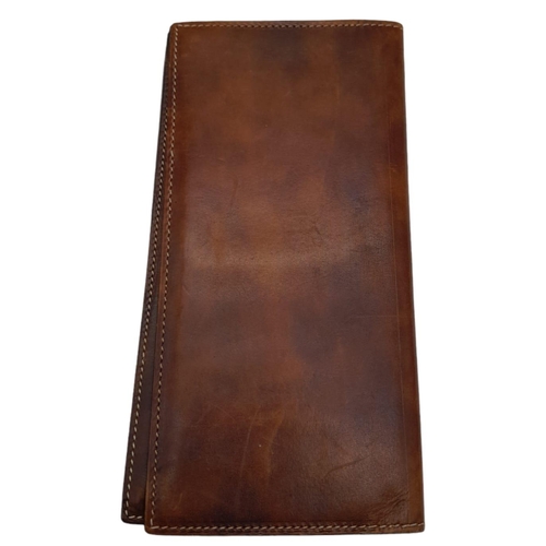 507 - Berluti Brown Leather Long Wallet.
Stitched throughout on quality leather, this unisex wallet opens ... 