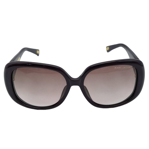 521 - Beautiful pair of Marc Jacobs Purple Sunglasses.
Made in Italy. Big bold frame with funky gemmed lov... 