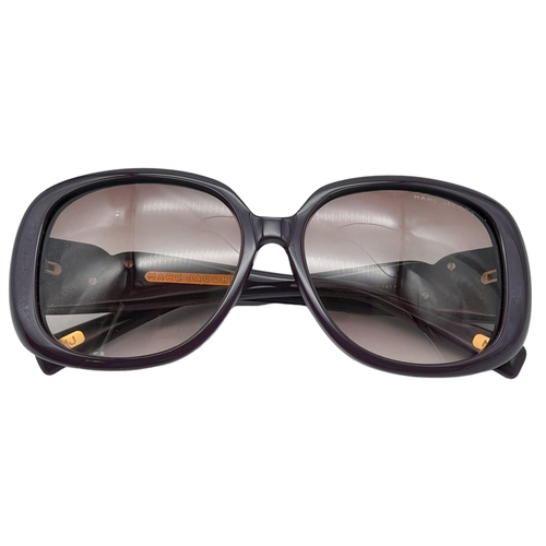 521 - Beautiful pair of Marc Jacobs Purple Sunglasses.
Made in Italy. Big bold frame with funky gemmed lov... 