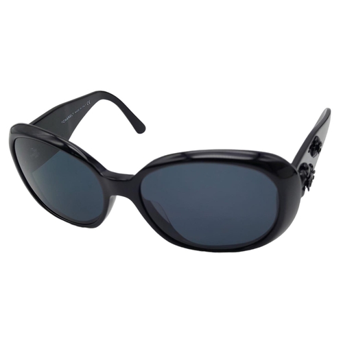 556 - Black Chanel Sunglasses with Floral Motifs. 
Built to be worn whilst driving a small convertible car... 