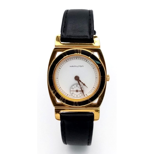 557 - A Men’s 1980’s Hamilton Piping Rock, 18 Carat Gold Electroplated, Second
Dial Quartz Watch Being the... 