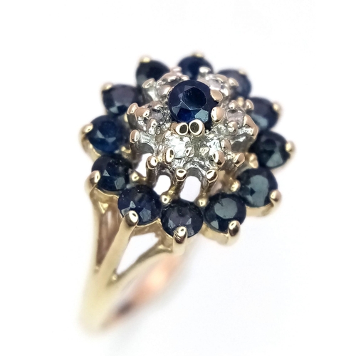 694 - A 9K YELLOW GOLD DIAMOND & SAPPHIRE CLUSTER RING. Size L/M, 2.6g total weight.    Ref: 4893