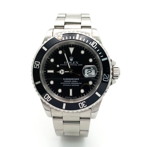 8 - A Rolex Oyster Submariner Gents Watch. Stainless steel bracelet and case - 40cm. Black dial with dat... 