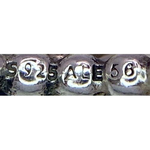 1033 - A STERLING SILVER PANDORA TURQUISE DECEMBER BIRTH STONE RING. Size O or 56, 3.7g total weight.