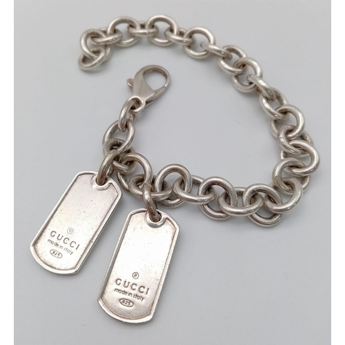 A Gucci dog tag belcher link silver bracelet. Total weight 34G