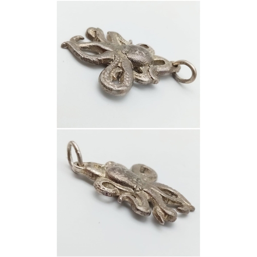 1104 - A SILVER OCTOPUS PENDANT. Approximately 4.7cm length (including bail), 9.7g weight.    Ref: SC 7014