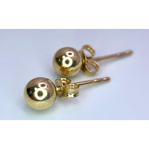 1172 - A PAIR OF 9K YELLOW GOLD BALL STUD EARRINGS. 0.4g total weight.