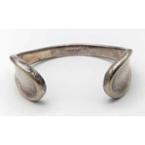 1377 - A 925 silver Tiffany & Co cuff bangle. Total weight 38.3G. Widest inner length 6cm.