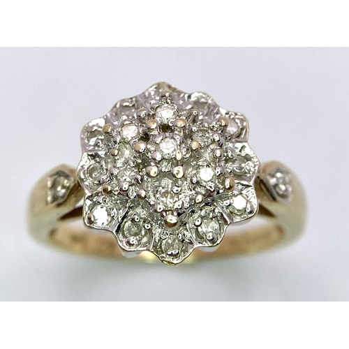 523 - A 9K YELLOW GOLD DIAMOND CLUSTER RING. Size M, 0.20ctw, 3.7g total weight.