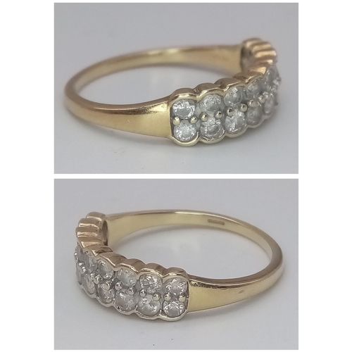 537 - A 9K YELLOW GOLD DOUBLE ROW DIAMOND RING. Size S, 0.70ctw, 3g total weight.