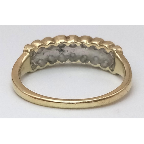 537 - A 9K YELLOW GOLD DOUBLE ROW DIAMOND RING. Size S, 0.70ctw, 3g total weight.