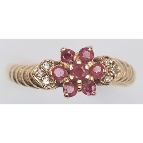 551 - A 14K YELLOW GOLD RUBY & DIAMOND CLUSTER RING. Size M, 2.2g total weight.