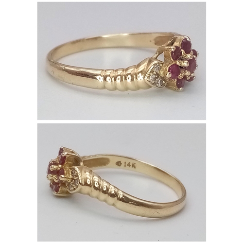 551 - A 14K YELLOW GOLD RUBY & DIAMOND CLUSTER RING. Size M, 2.2g total weight.