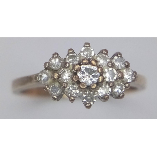 579 - 9K YELLOW GOLD DIAMOND CLUSTER RING.
0.35CTW, WEIGHS 2.3G AND SIZE M.

REF: SC 7071