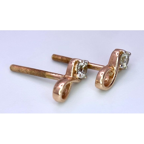 634 - A PAIR OF 18K ROSE GOLD DIAMOND STUD EARRINGS. Need butterfly backs. 1cm length, 0.10ctw, 1.1g total... 