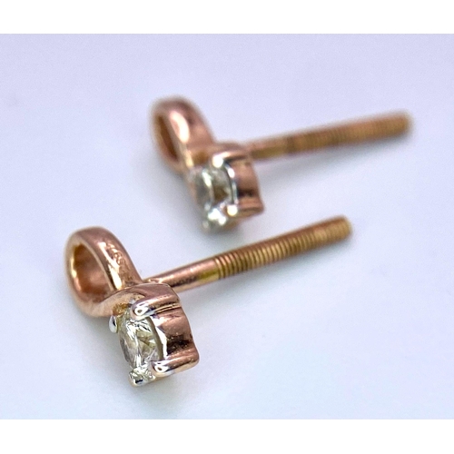 634 - A PAIR OF 18K ROSE GOLD DIAMOND STUD EARRINGS. Need butterfly backs. 1cm length, 0.10ctw, 1.1g total... 