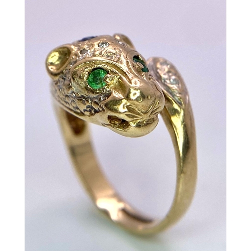 642 - A 9K GOLD DIAMOND , SAPPHIRE AND EMERALD SET PANTHER RING .   4.8gms   size J