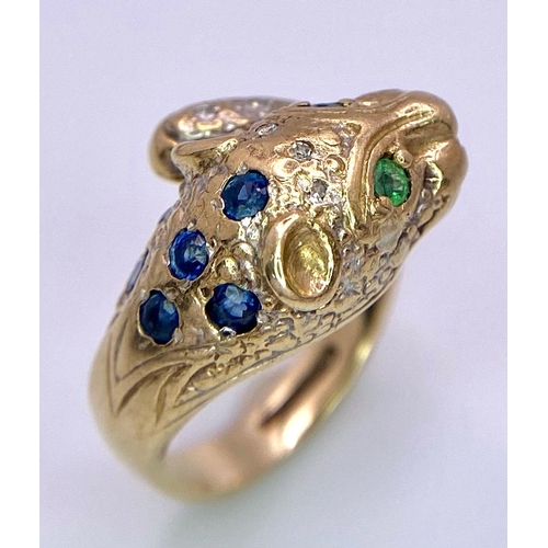 642 - A 9K GOLD DIAMOND , SAPPHIRE AND EMERALD SET PANTHER RING .   4.8gms   size J