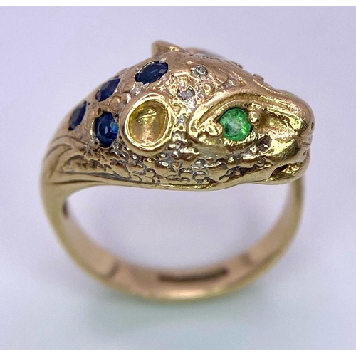 642 - A 9K GOLD DIAMOND , SAPPHIRE AND EMERALD SET PANTHER RING .   4.8gms   size J