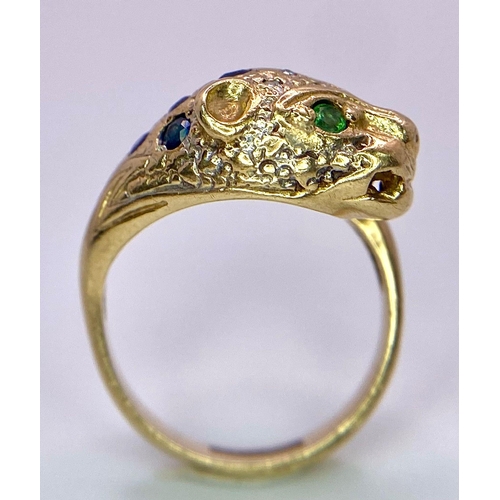 642 - A 9K GOLD DIAMOND , SAPPHIRE AND EMERALD SET PANTHER RING .   4.8gms   size J