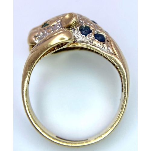 642 - A 9K GOLD DIAMOND , SAPPHIRE AND EMERALD SET PANTHER RING .   4.8gms   size J