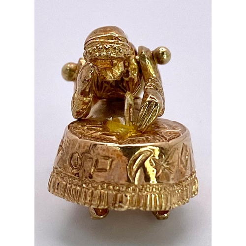 649 - A 9K GOLD FORTUNE TELLER CHARM (MISSING THE CRYSTAL BALL)   5.2gms