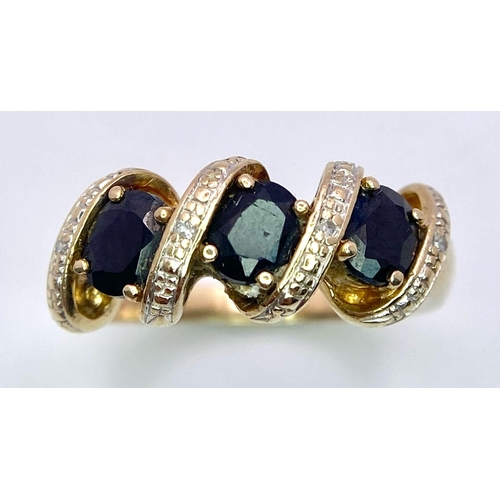 677 - A 9K GOLD DIAMOND AND SAPPHIRERING .   3.8gms   size L