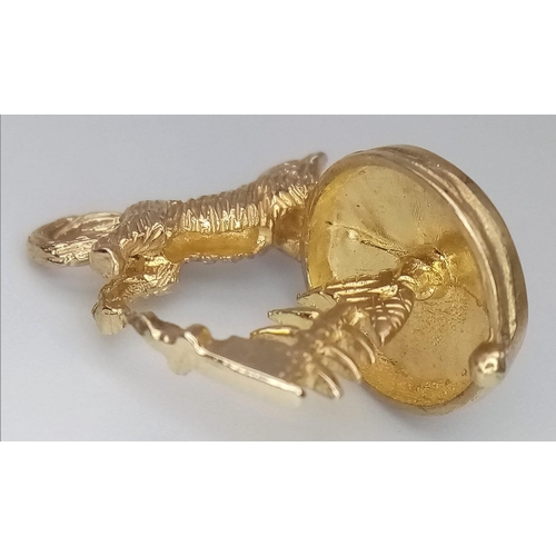 684 - A 9K GOLD CAT WITH FISH BONE CHARM .     3.3gms