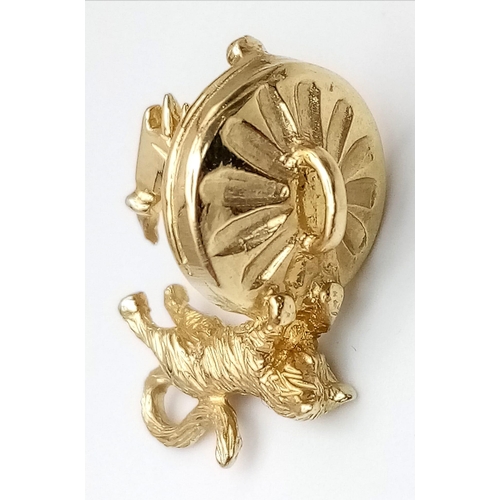 684 - A 9K GOLD CAT WITH FISH BONE CHARM .     3.3gms