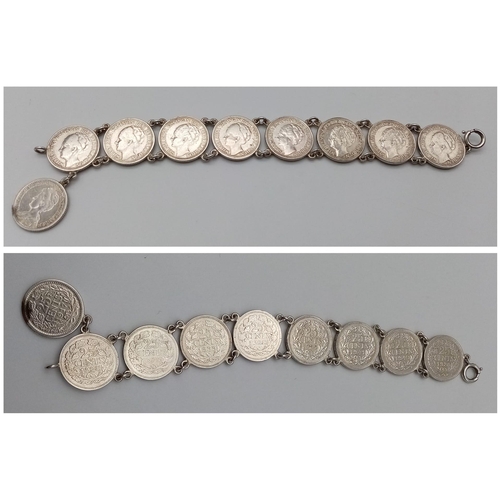 701 - A SILVER COIN BRACELET SET WITH 9 x 25 CENTS COINS. DATE RANGES 1917 - 1941. 18CM LENGTH, 35G TOTAL ... 