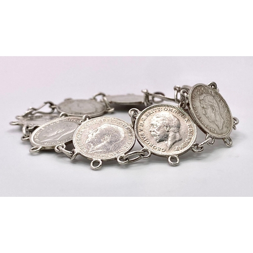 957 - A SILVER COIN BRACELET SET WITH 9 THREE PENCE PIECES. DATE RANGES 1912 TO 1940. 18.5CM LENGTH, 15.8G... 