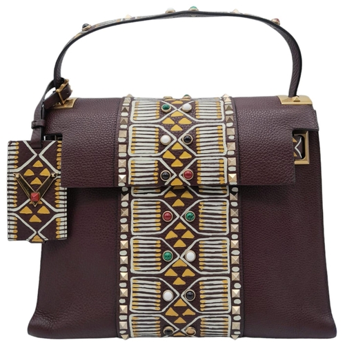 101 - A Valentino Garavani Tribal Rockstud Bag.
Quality textured leather, purple with tribal design with p... 