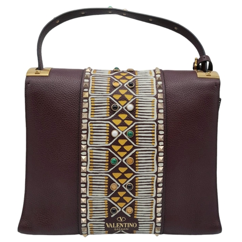 101 - A Valentino Garavani Tribal Rockstud Bag.
Quality textured leather, purple with tribal design with p... 