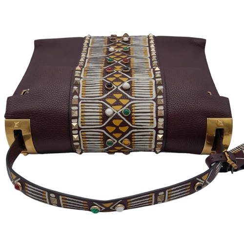 101 - A Valentino Garavani Tribal Rockstud Bag.
Quality textured leather, purple with tribal design with p... 