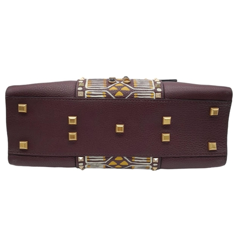 101 - A Valentino Garavani Tribal Rockstud Bag.
Quality textured leather, purple with tribal design with p... 