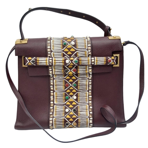 101 - A Valentino Garavani Tribal Rockstud Bag.
Quality textured leather, purple with tribal design with p... 