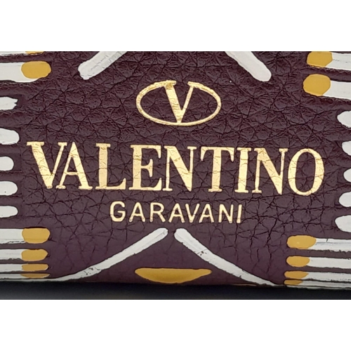 101 - A Valentino Garavani Tribal Rockstud Bag.
Quality textured leather, purple with tribal design with p... 