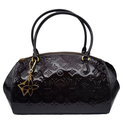 185 - Louis Vuitton Sherwood PM Shoulder Bag.
Features a Purple Monogrammed Patent Leather exterior with G... 