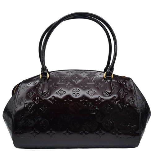 185 - Louis Vuitton Sherwood PM Shoulder Bag.
Features a Purple Monogrammed Patent Leather exterior with G... 