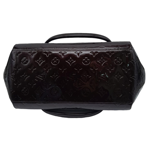 185 - Louis Vuitton Sherwood PM Shoulder Bag.
Features a Purple Monogrammed Patent Leather exterior with G... 